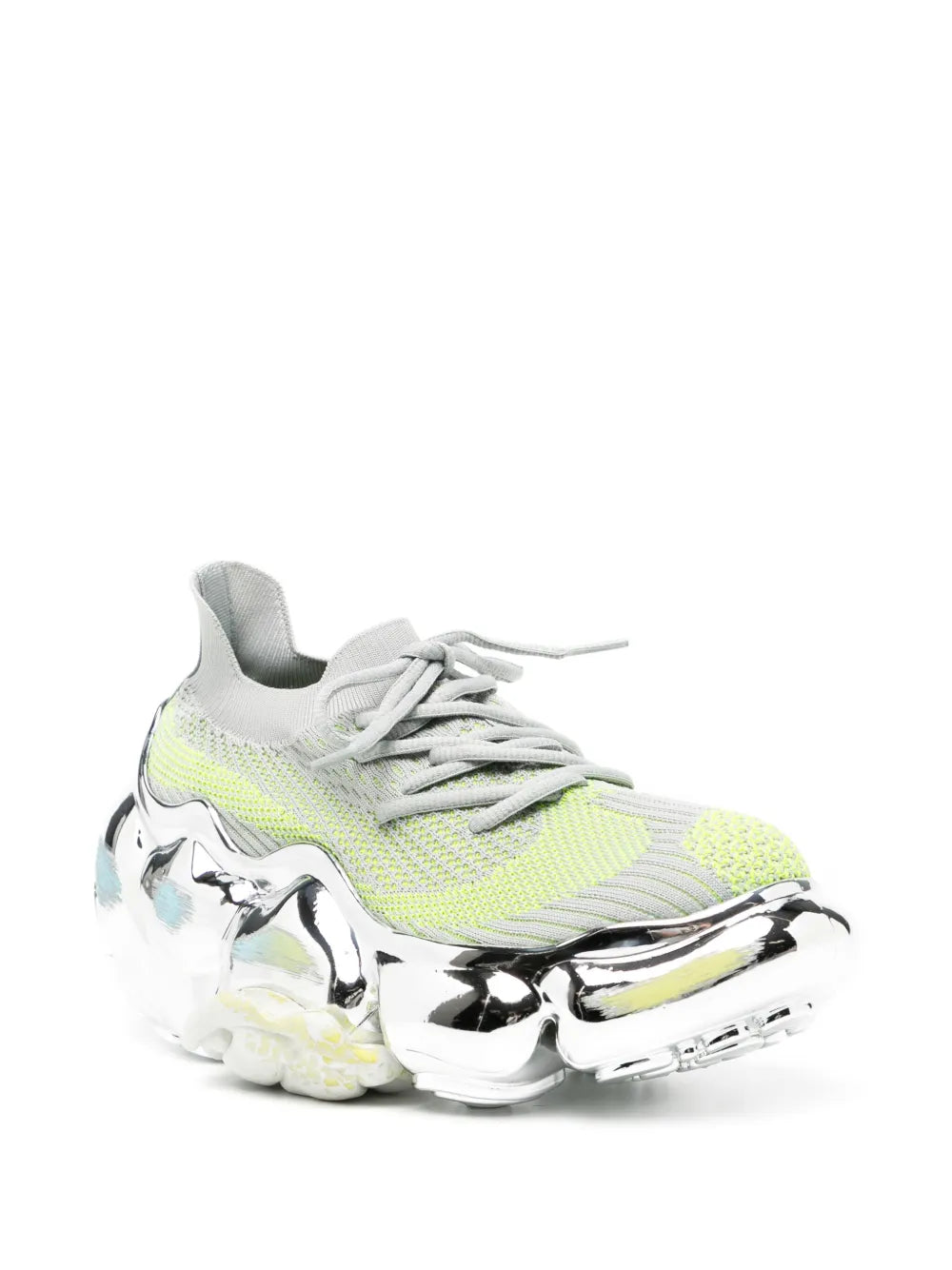 Lace-up sneaker with neon green patterned upper and glossy silver chrome sole.