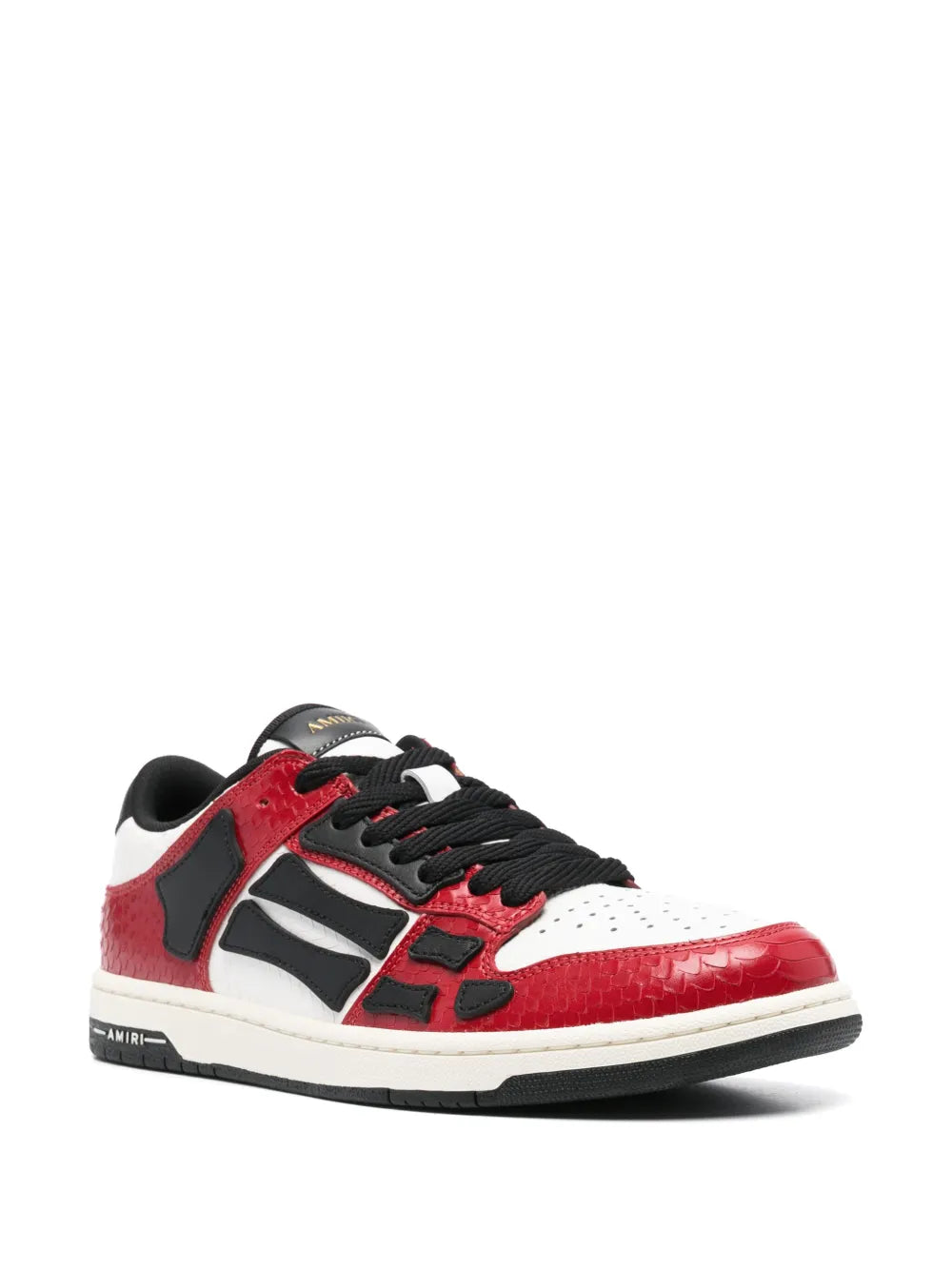 Brick red and white low-top lace-up sneakers with black accents and logo detail