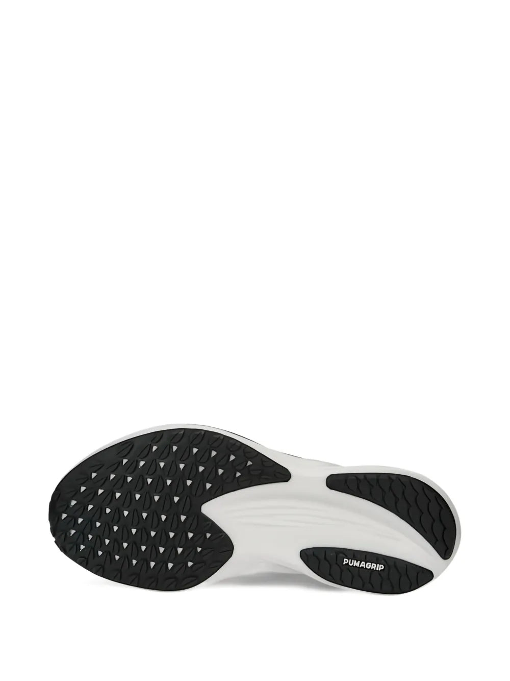 Rubber outsole for black running shoe with textured tread and PUMA print