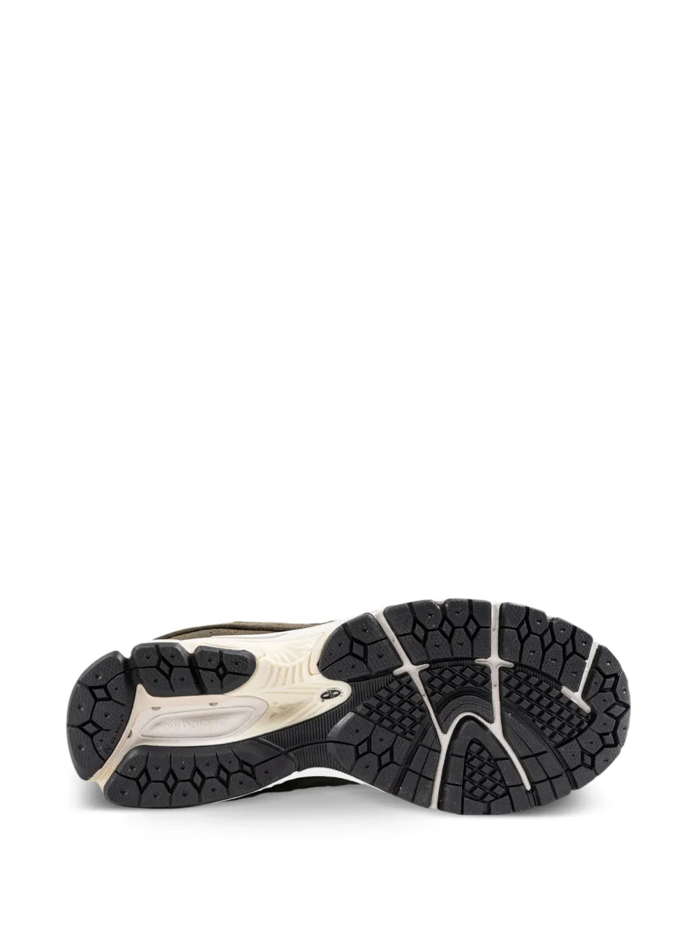 Sneaker outsole view with dark tread pattern and light midsole edge