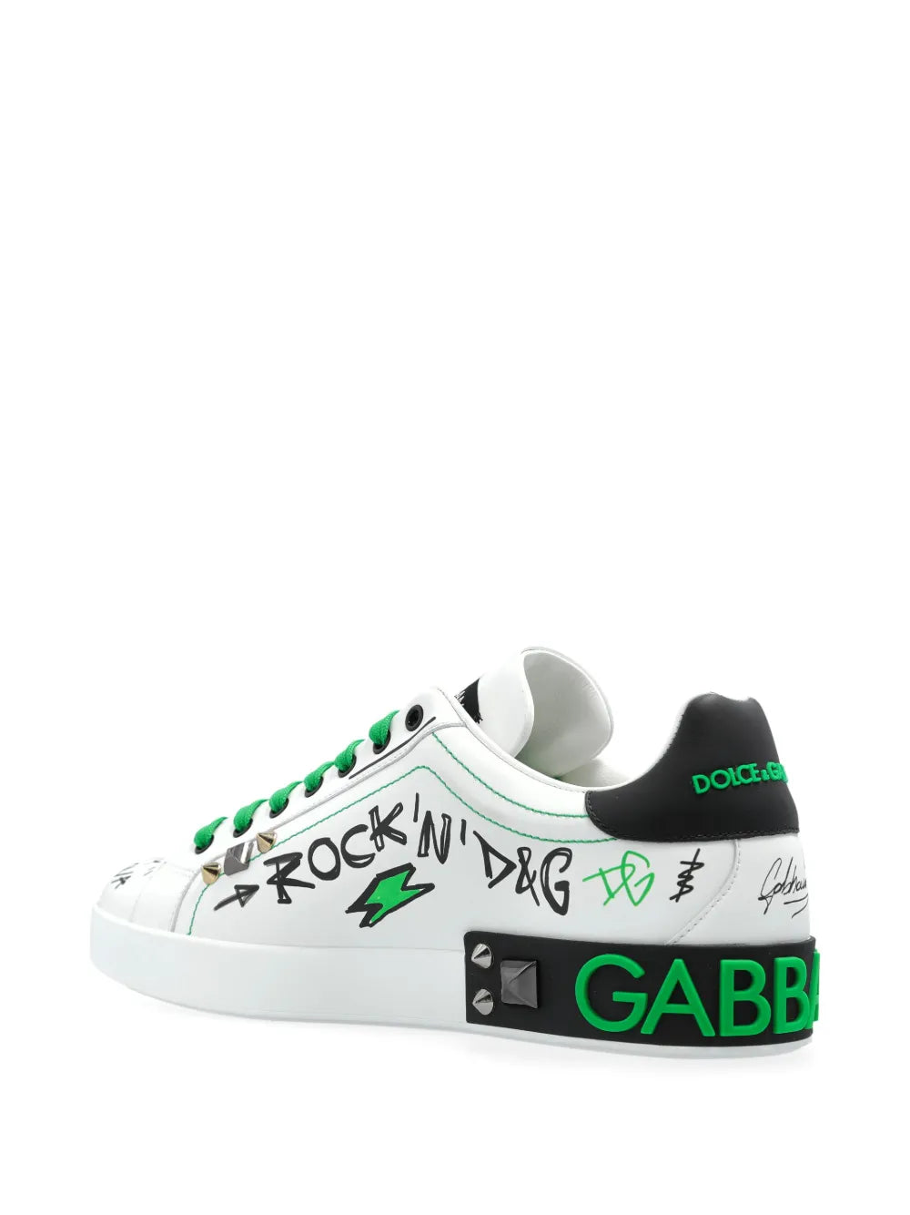 White sneakers with green laces and green logo text on heel, graffiti side art