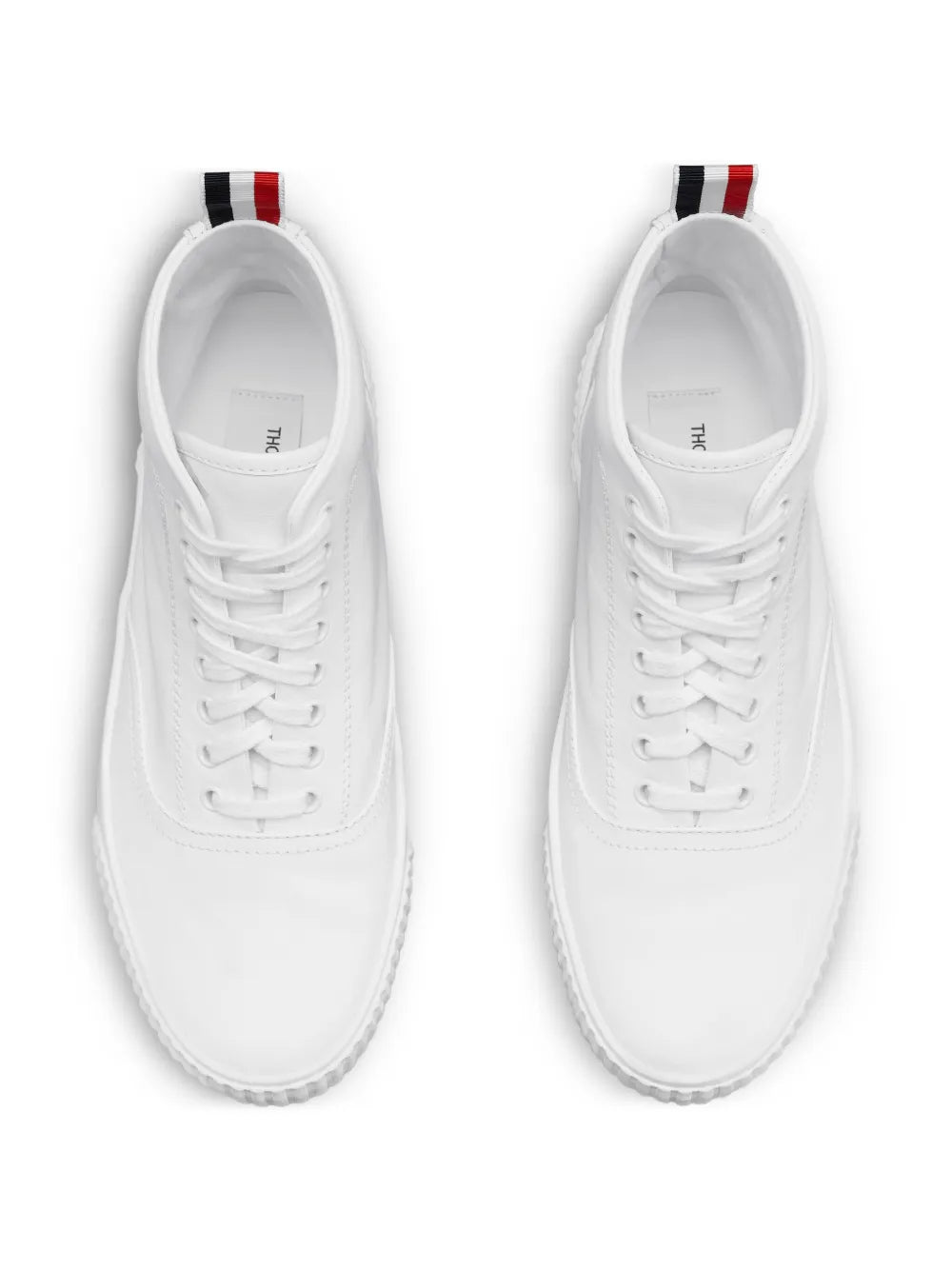 White lace-up sneakers with interior label and top eyelets