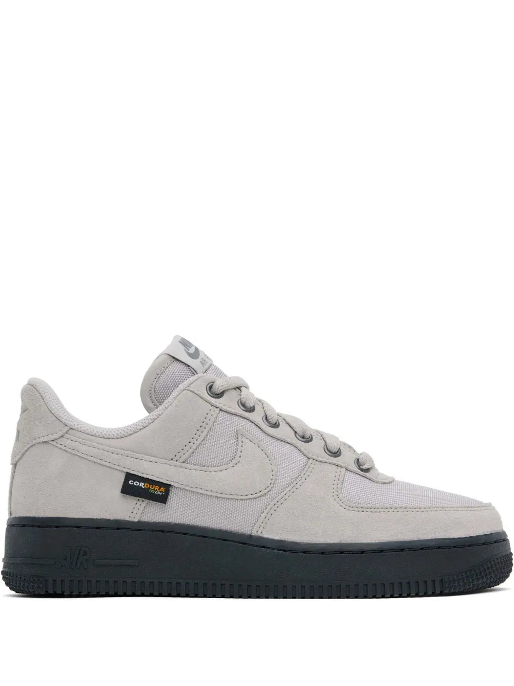 Nike low-top sneakers, light grey leather, lace-up with Swoosh and dark rubber sole