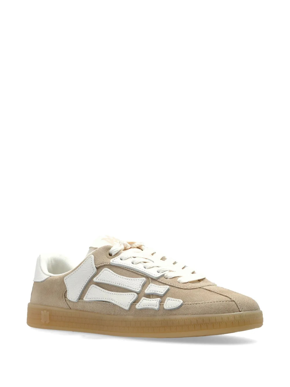 Beige low-top sneakers with white panels, lace-up front and gum rubber sole