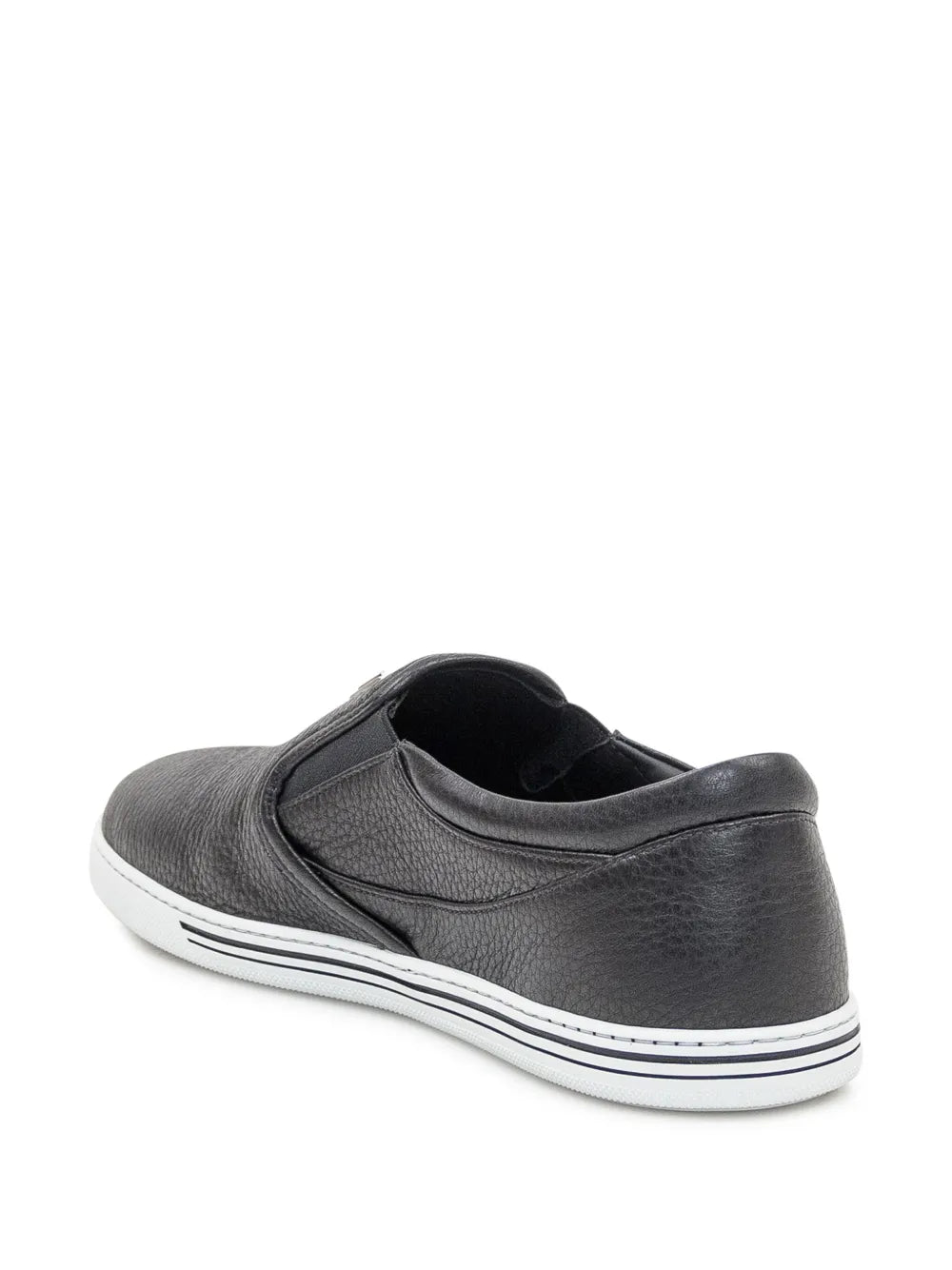 Black leather low-top sneakers, rear view with white rubber sole