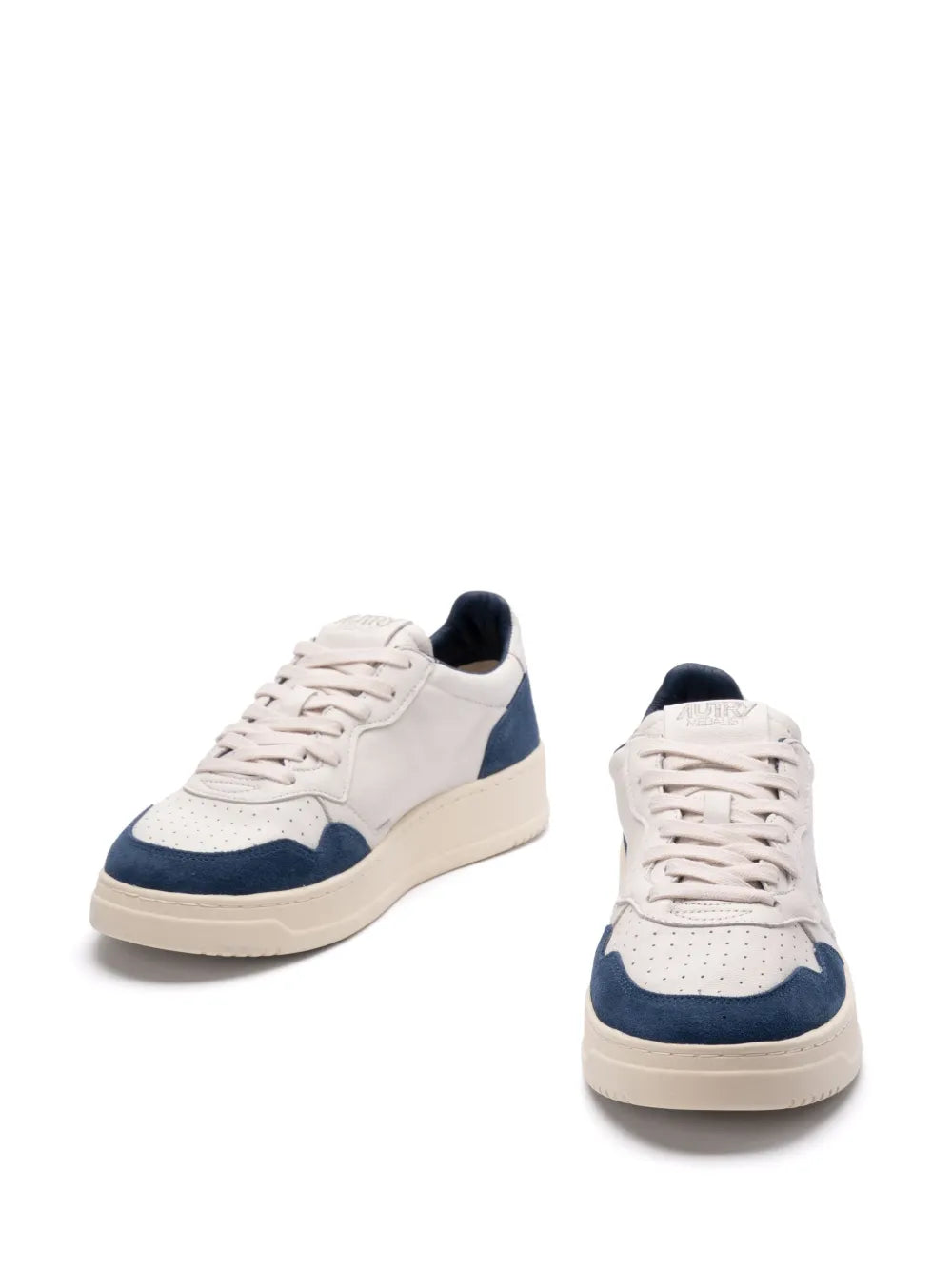 Pair of low-top lace-up sneakers, white uppers with navy side panels