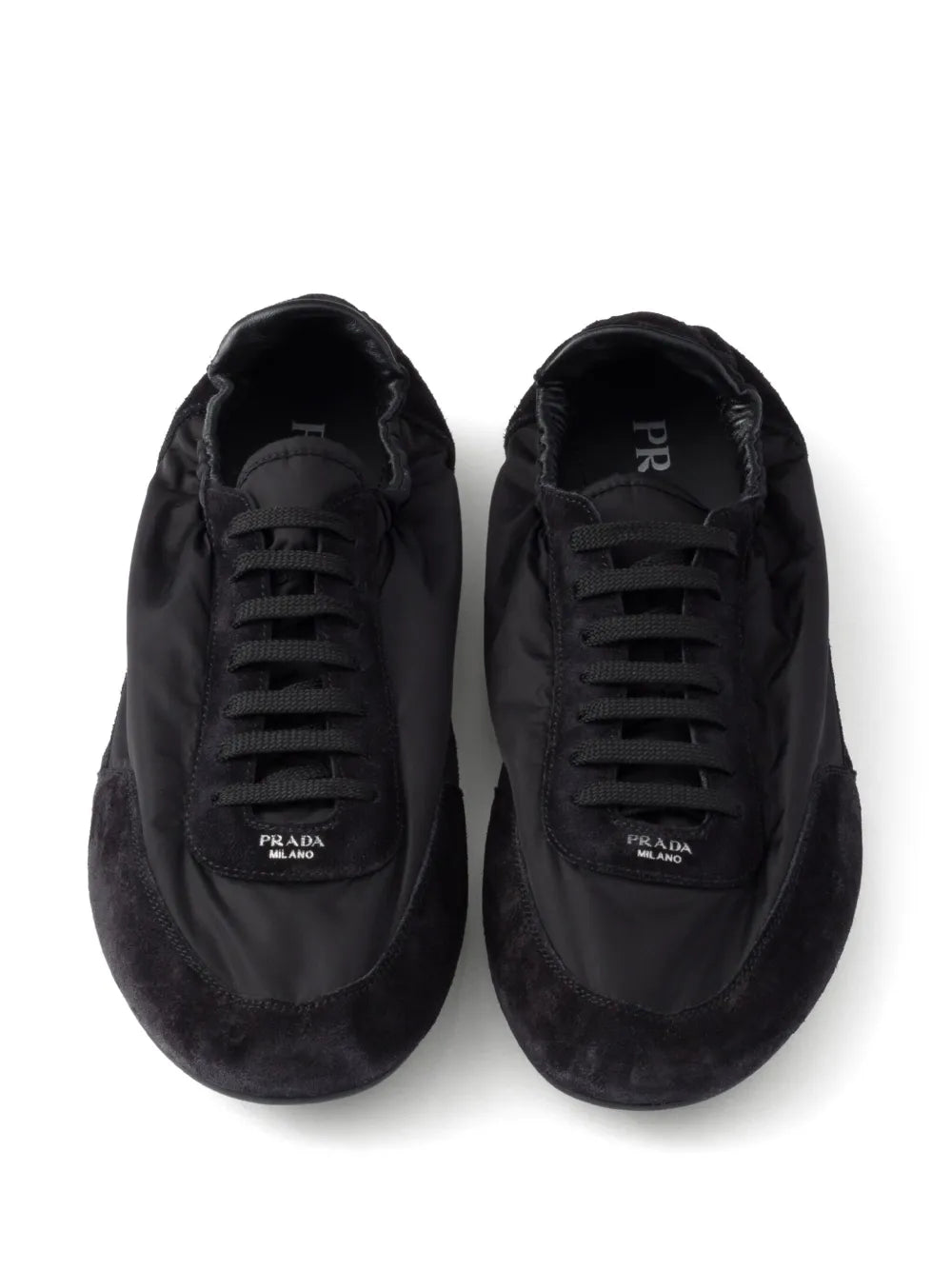 Black lace-up sneakers with PRADA MILANO logo on tongue lining
