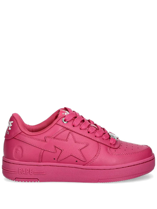 Pink low-top sneakers with lace-up and star logo, BAPE branding on side