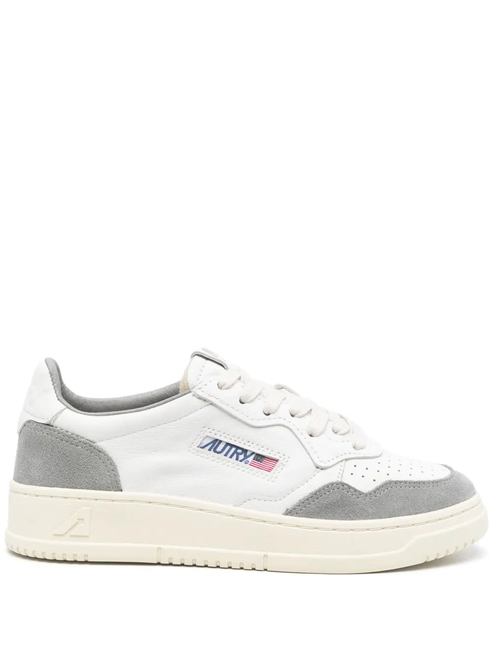 White leather low-top sneaker with gray side panels, lace-up front, cream sole
