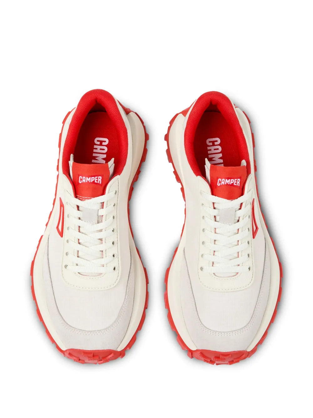 Pair of white sneakers with red lining and 'Camper' heel label