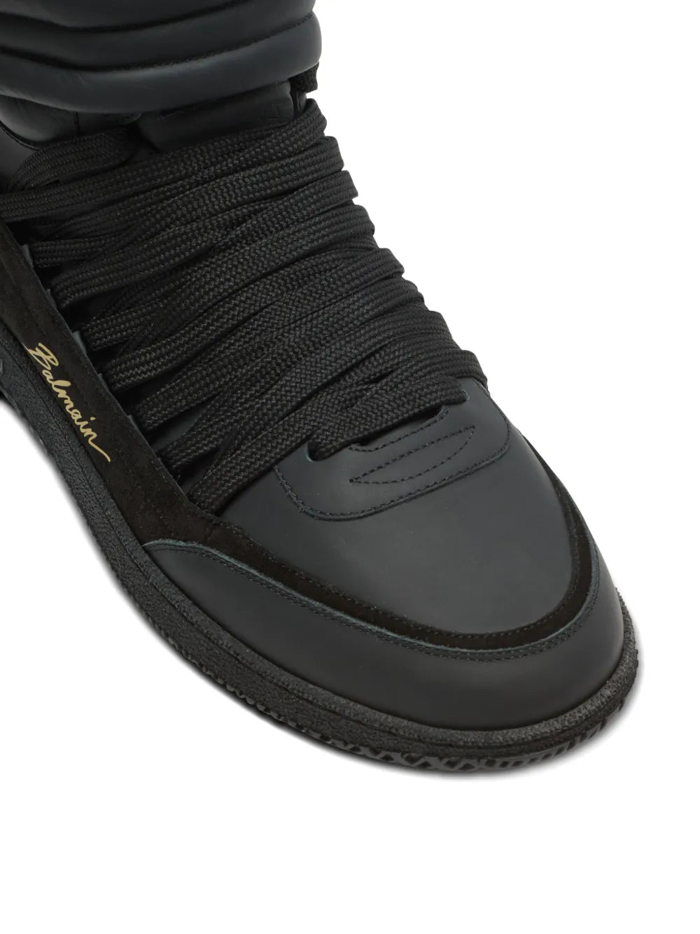 Black leather-panelled Balmain trainers, close-up of laced knit upper