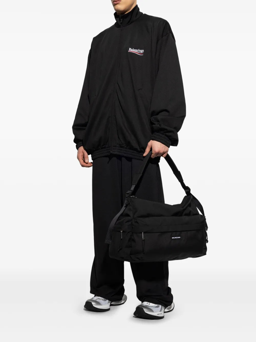 White Balenciaga Circuit sneakers worn with dark pants; chunky sole and mesh upper