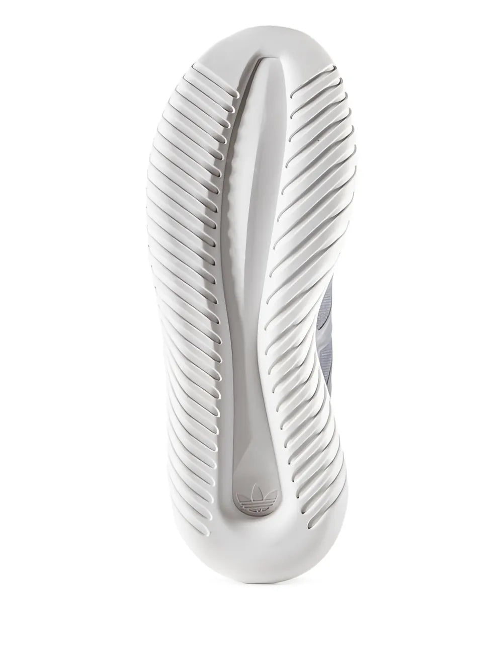 White adidas sneaker sole viewed from side, with deep tread ridges