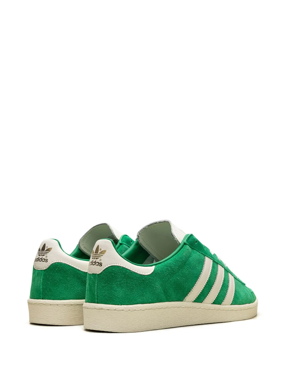 Pair of green adidas suede sneakers showing heel and three white stripe panels