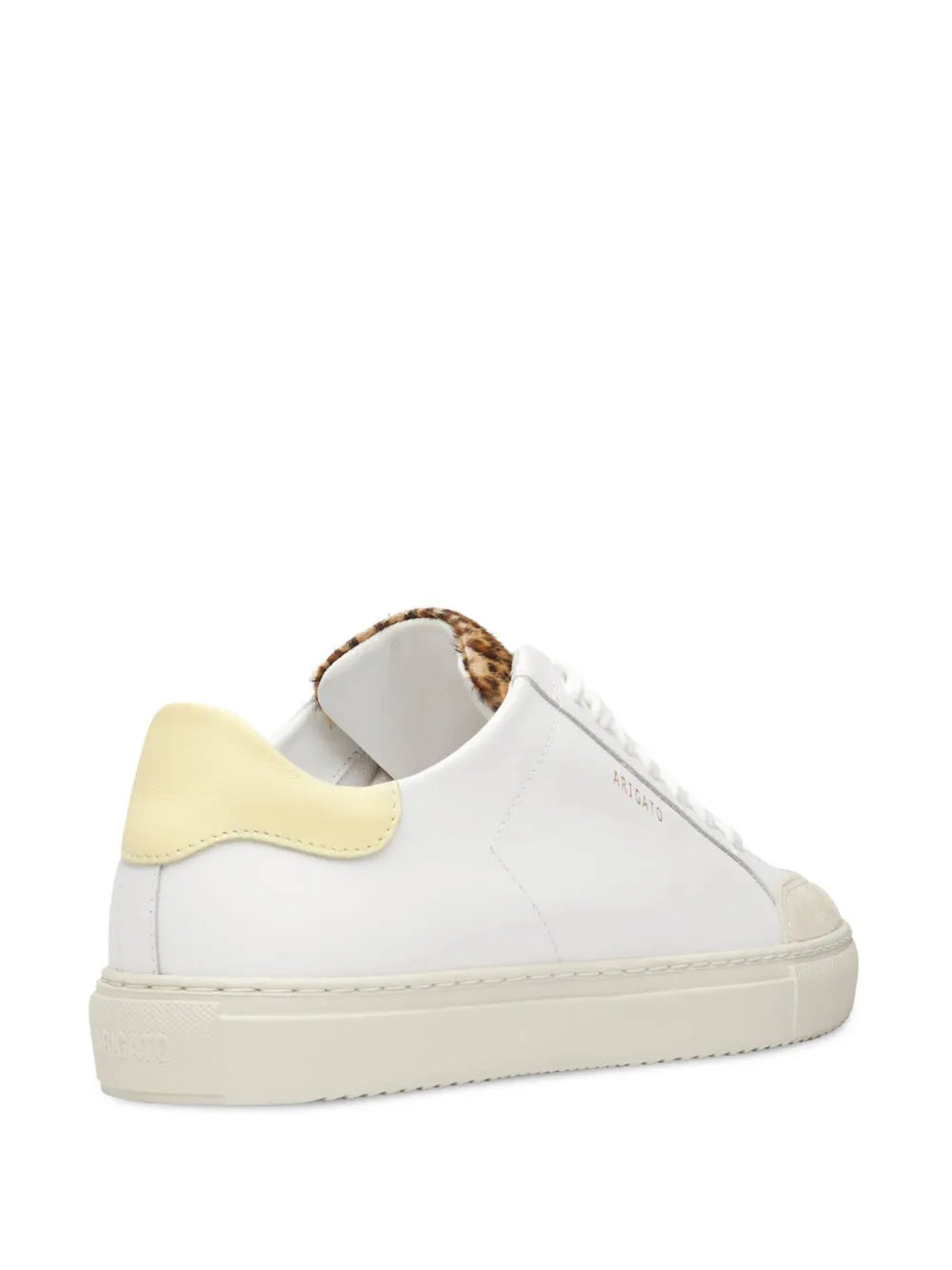 White low-top sneakers showing back heel with leopard print lining