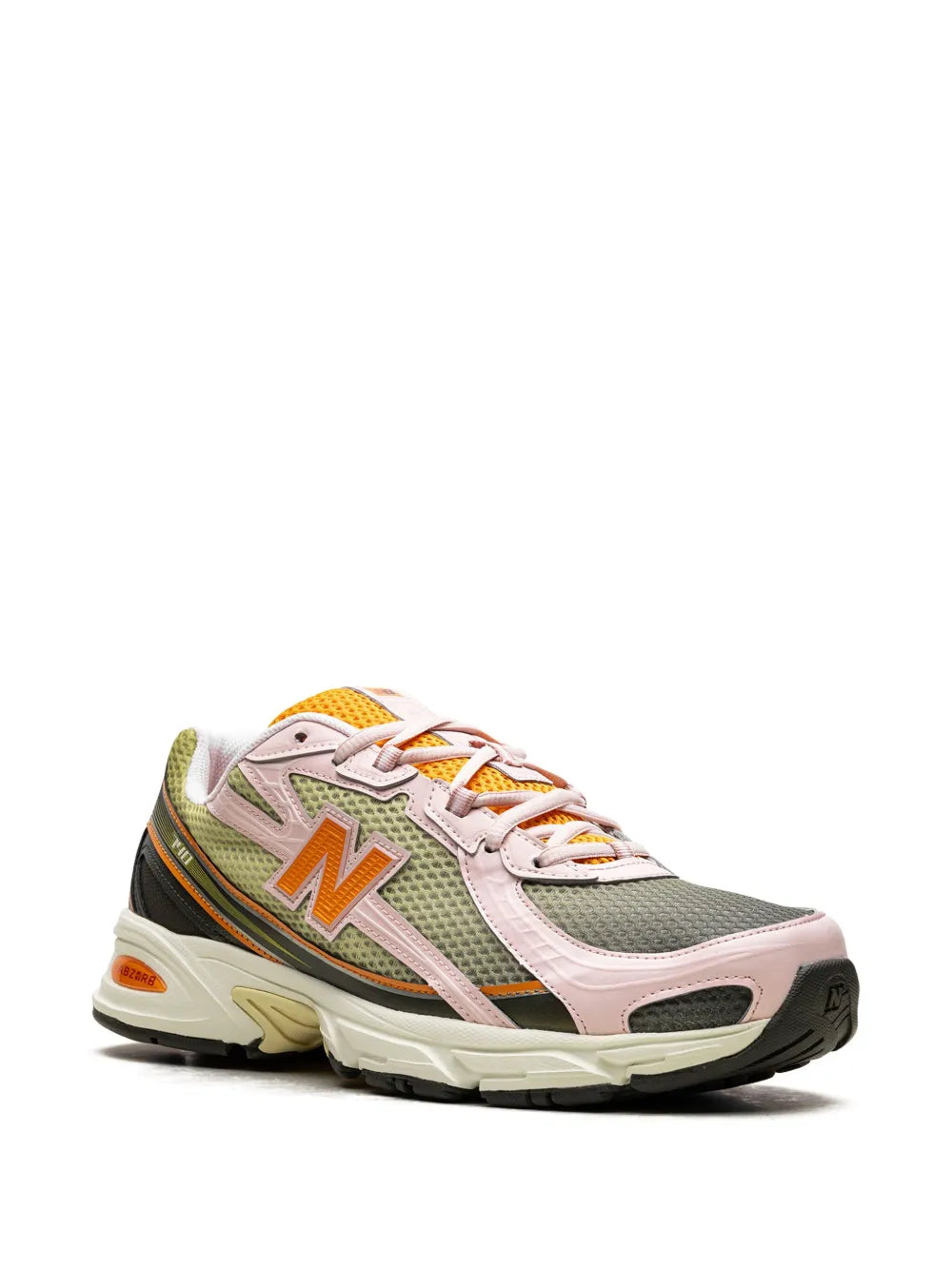 New Balance 740 sneakers in pink, green, and black with orange N logo and orange accents