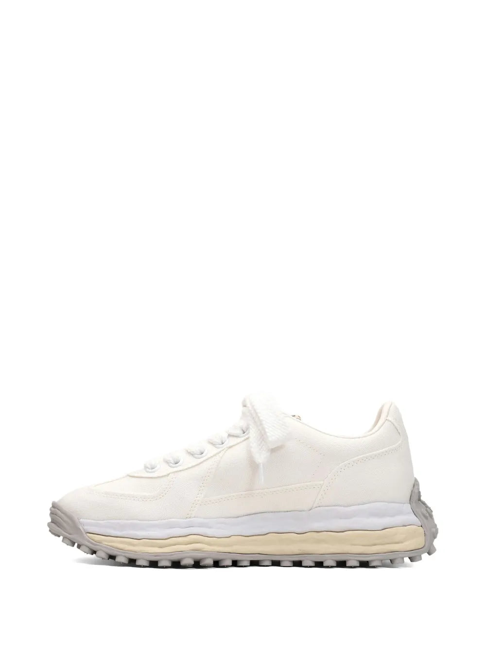 White low-top lace-up sneaker with padded collar and textured rubber sole