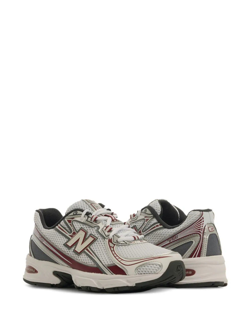 White/gray sneaker side view with red trim, lace-up, cushioned midsole