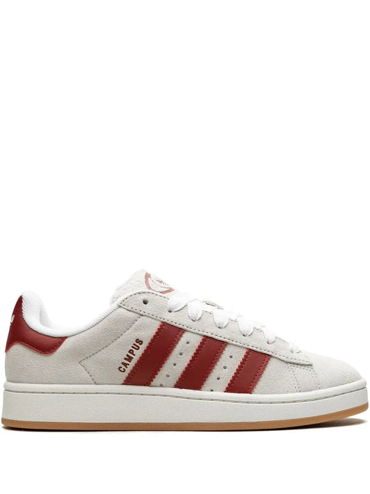 Low-top sneakers in off-white suede with red heel tab, three red stripes, gum sole