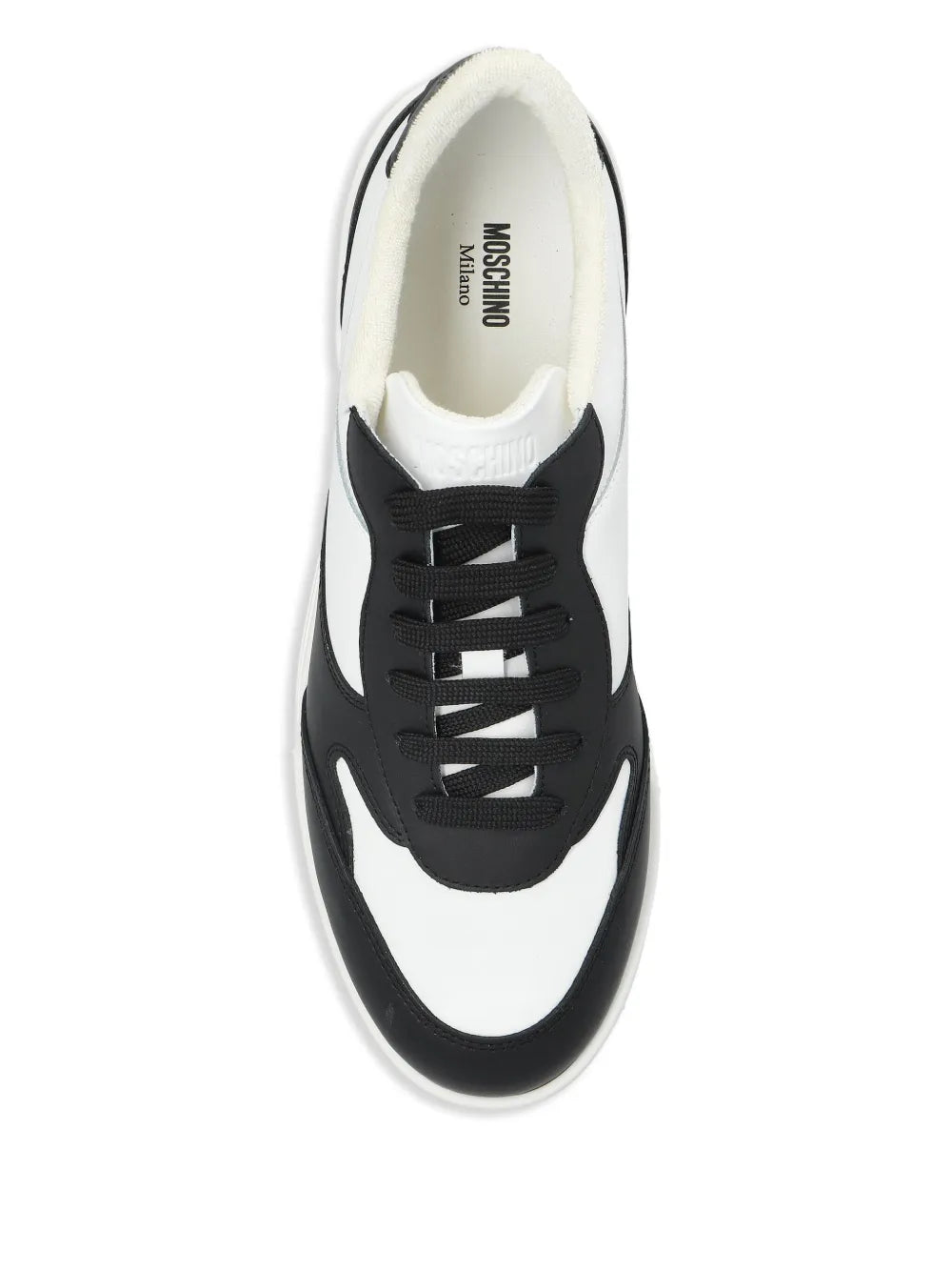 Moschino low-top sneakers, black-and-white uppers with logo text on inner lining.