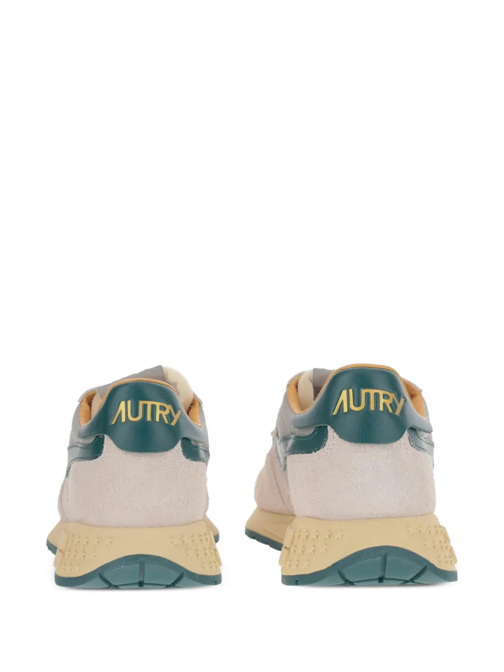 Light beige low sneakers with teal heel tab, Autry logo, and chunky tan sole