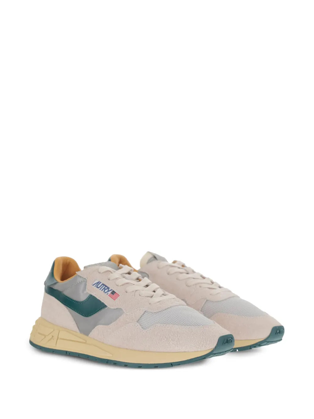 Light beige low-top sneakers with teal side stripes and tan rubber sole
