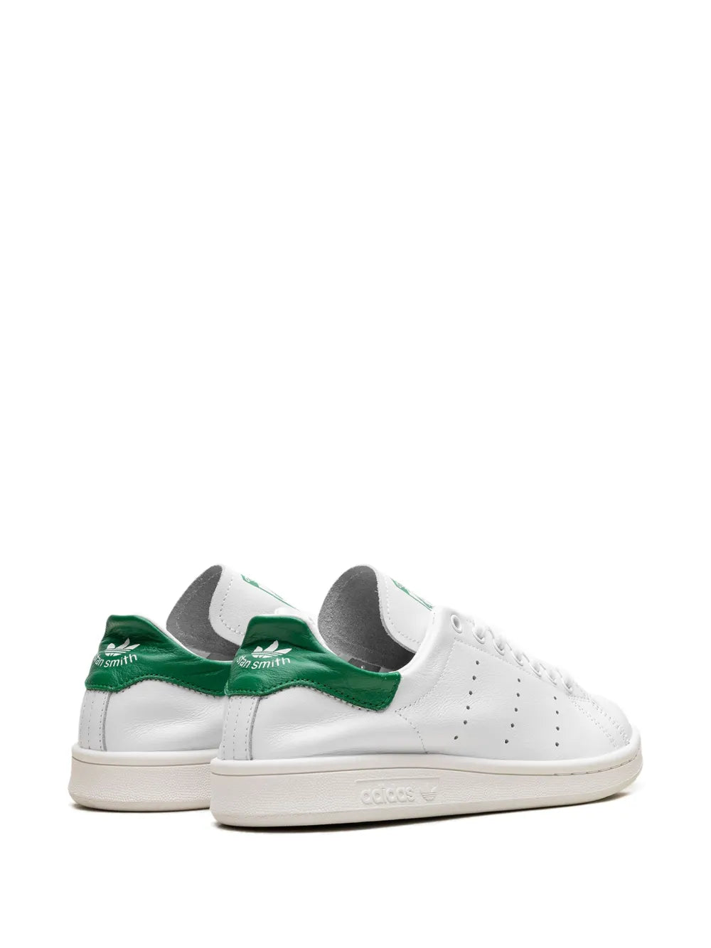 White leather sneaker, side view with green heel overlay and lace-up closure