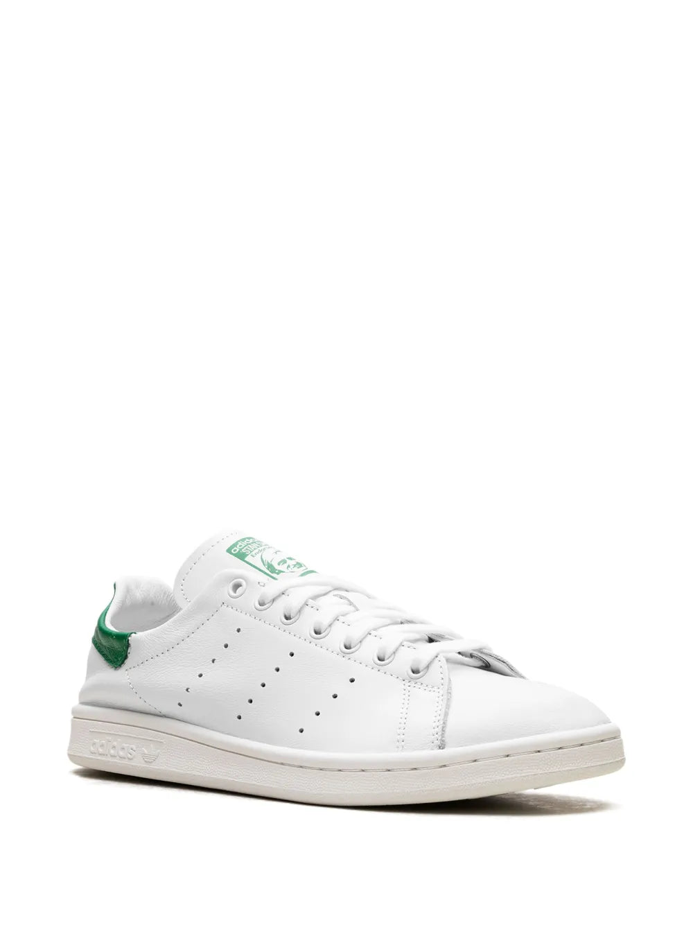 White sneaker with green collar detail, lace-up front and perforated toe