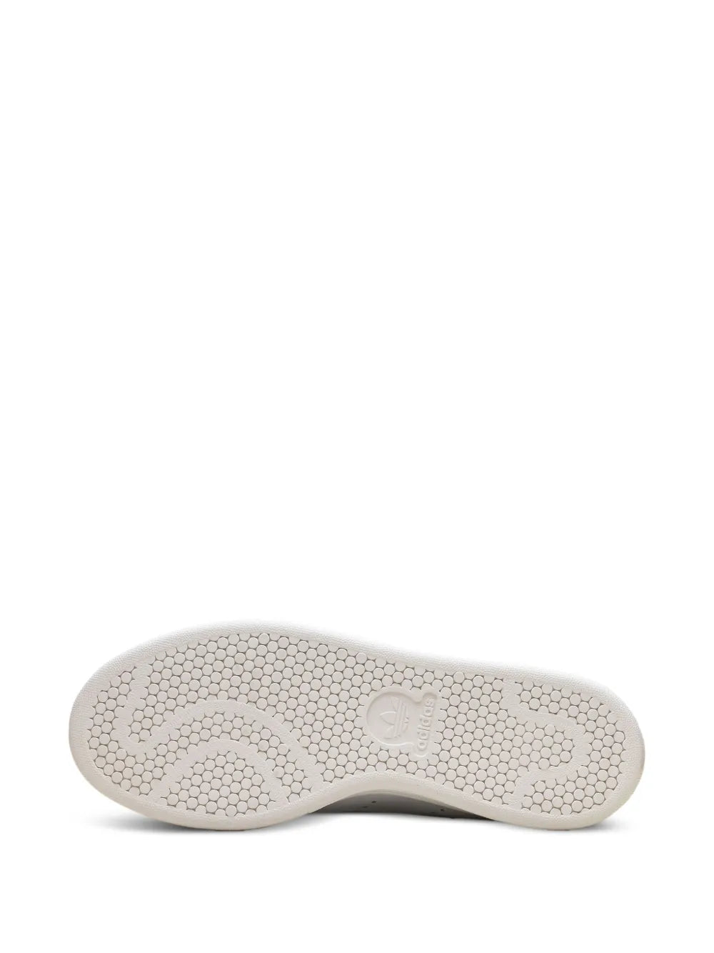 White sneaker outsole with textured tread pattern