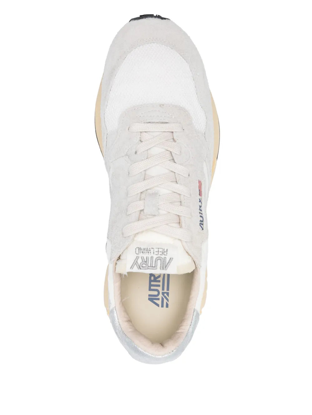 Autry lace-up sneaker close-up, white upper with laces and beige interior sole