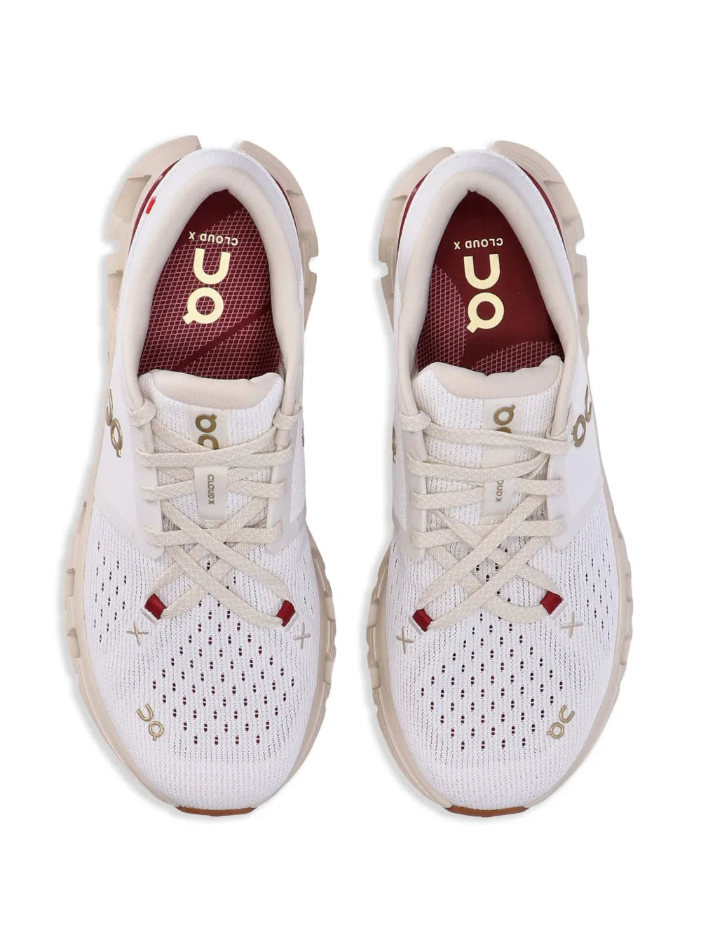 Beige/white lace-up sneakers with red-lined interior and fabric toe mesh