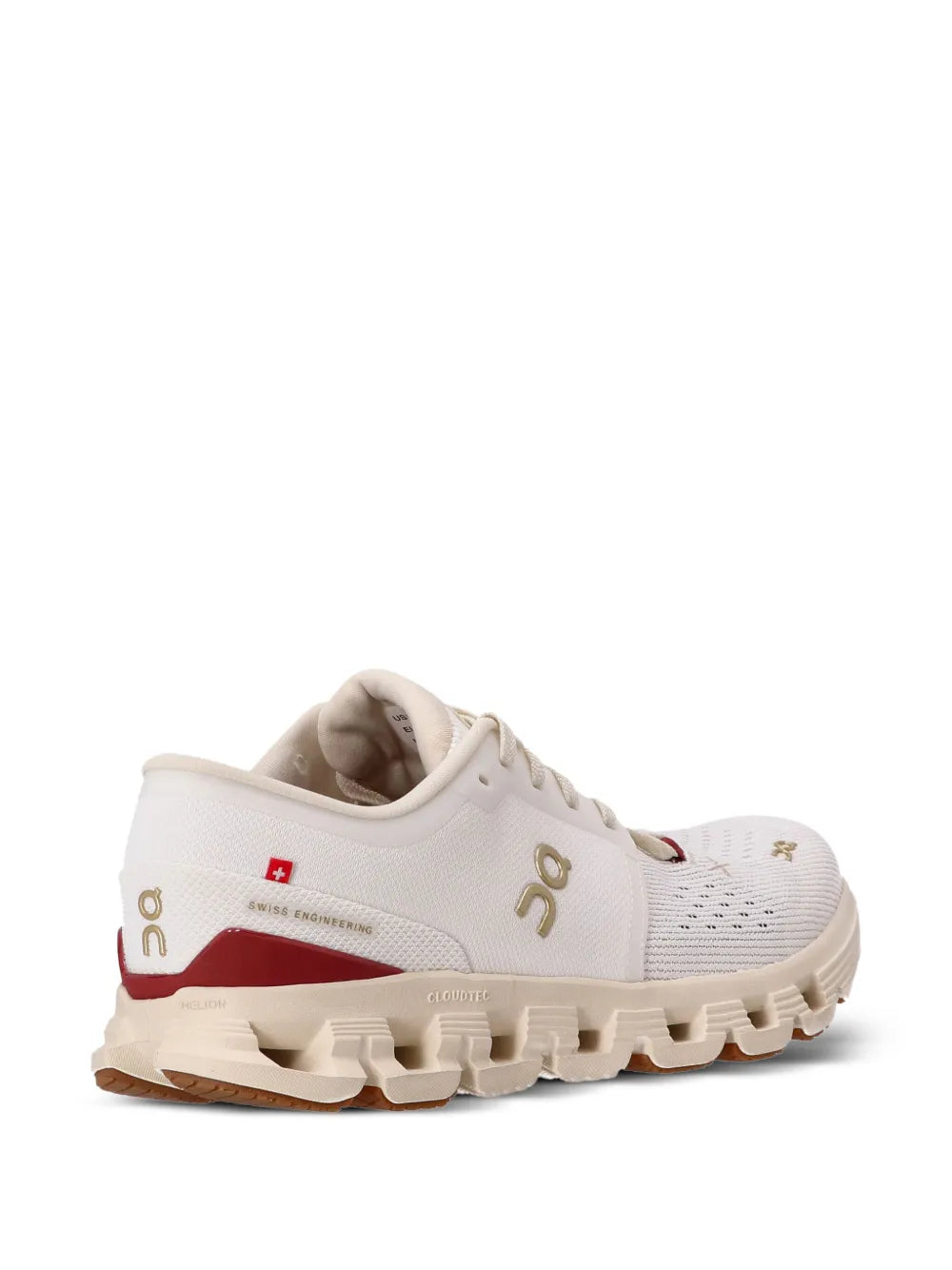 Beige/white running sneakers with cushioned heel and red mid-panel accent