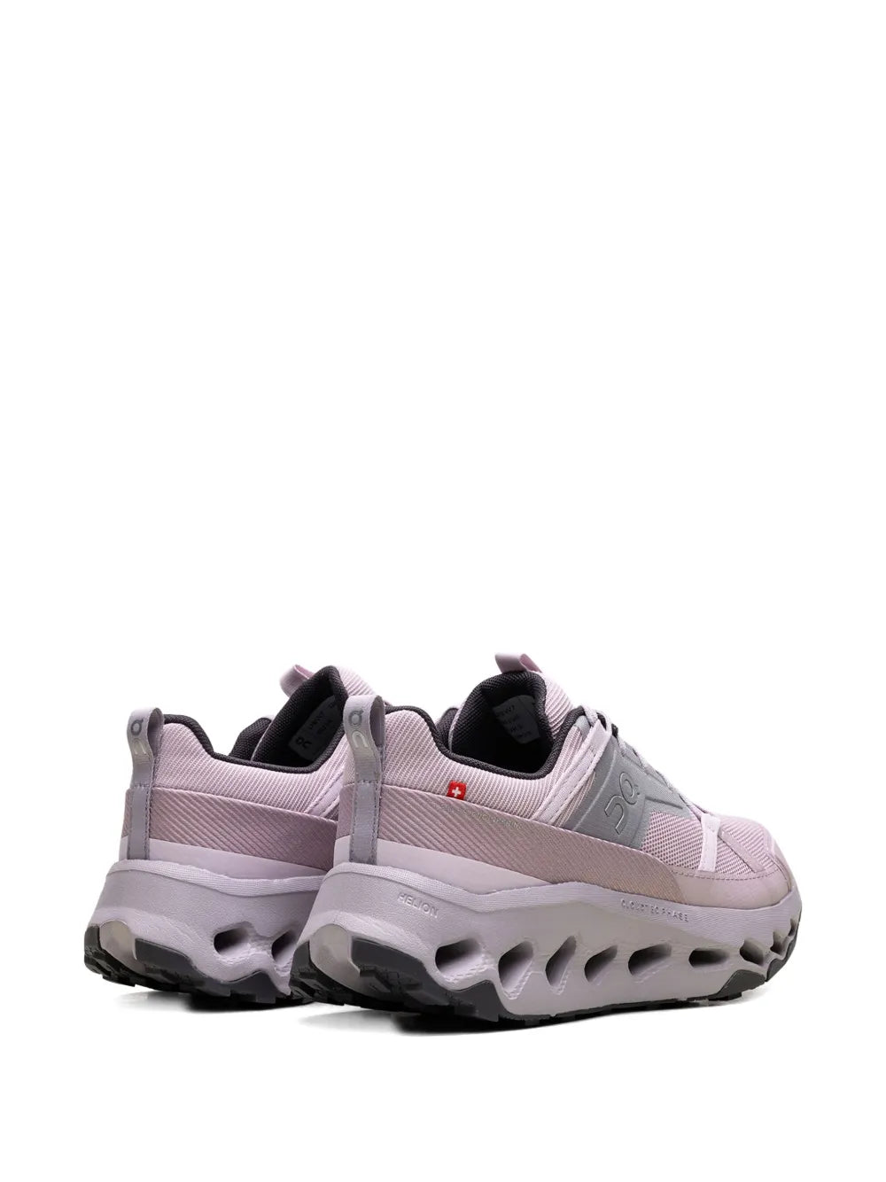 Pink lace-up running shoe, rear view, padded heel and cushioned platform outsole