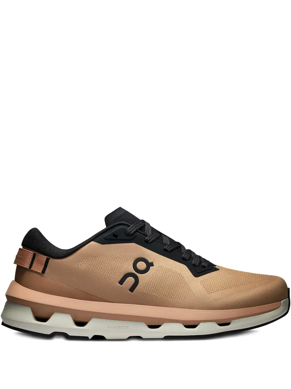 Light brown running shoes with black laces and CloudTec-style sole
