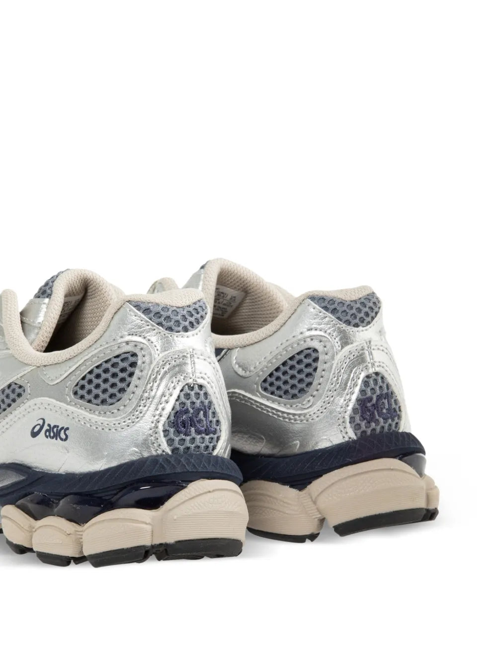Rear view of white sneakers with navy heel panels and thick black cushioning