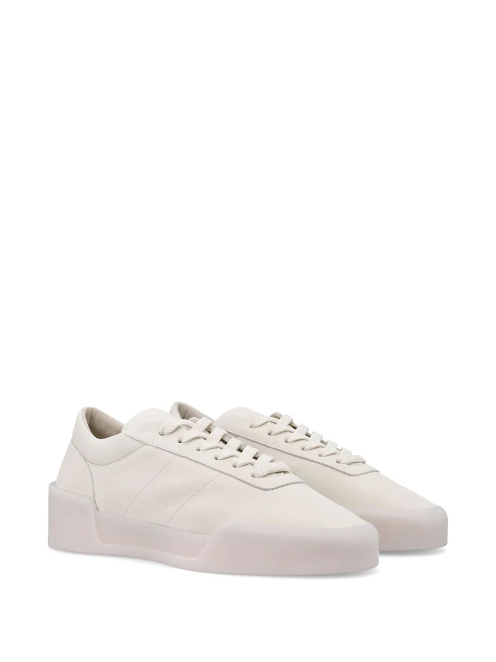 White aerobic sneakers, side view with lace-up, stitched panels, and chunky sole