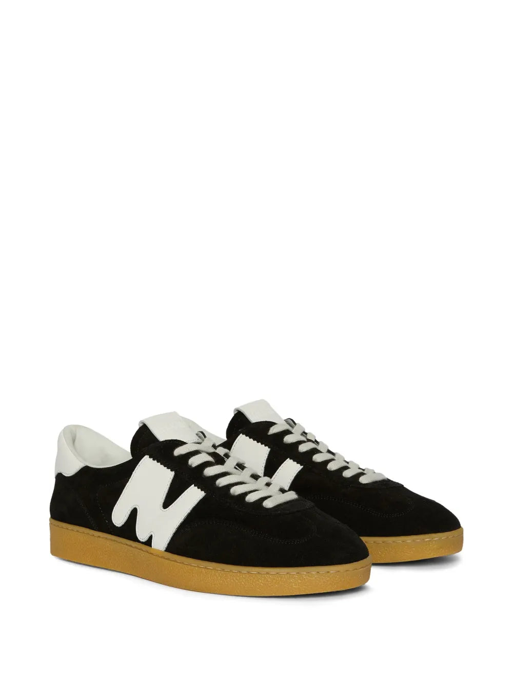 Black suede sneakers with white swoosh-style logo, lace-up, tan/gum rubber sole