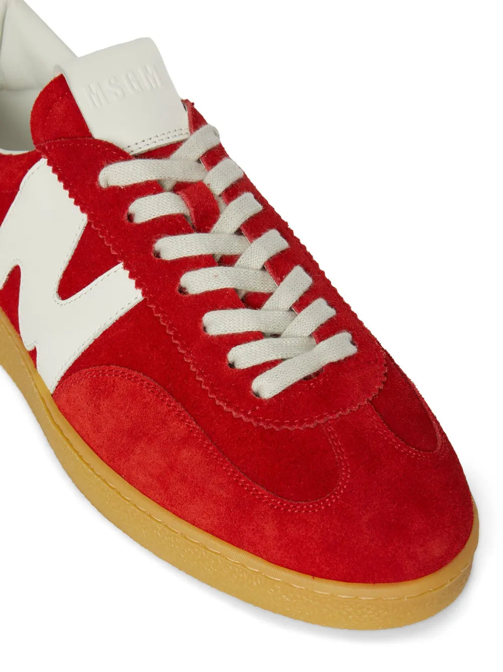 Red suede retro sneakers with white laces, white logo panel, tan gum sole