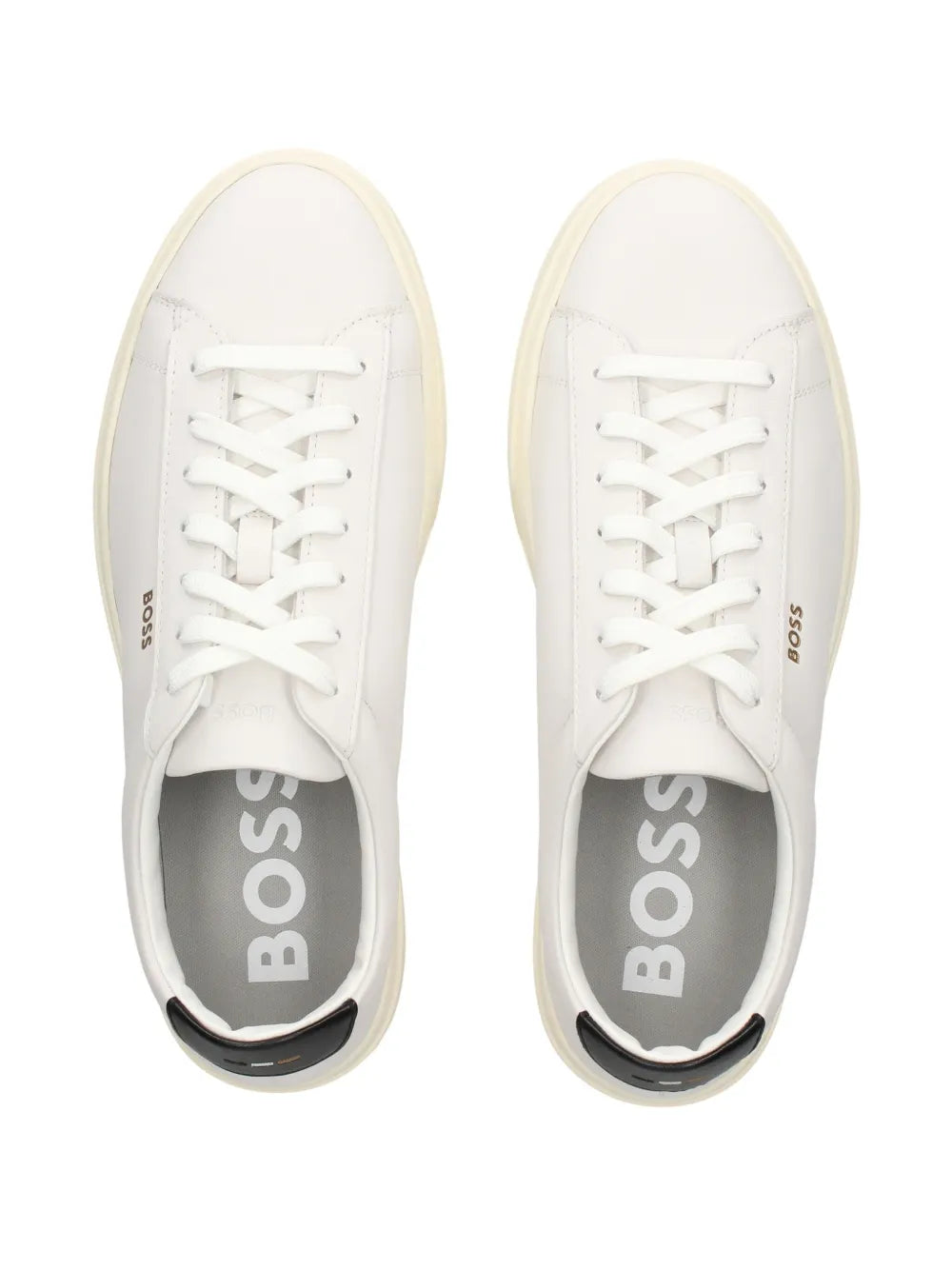 Pair of white sneakers with BOSS logo on tongue and interior