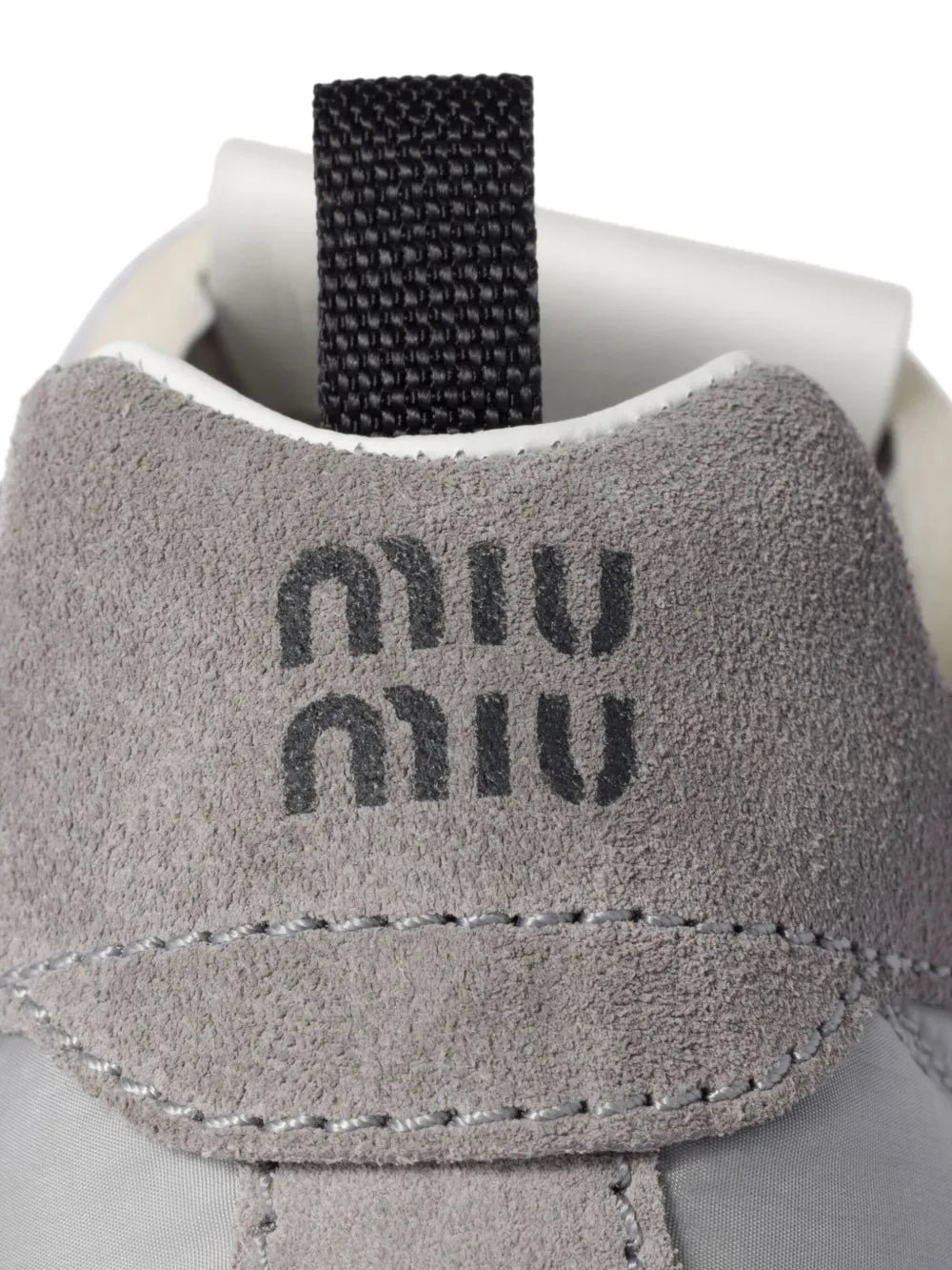 Grey suede heel with embroidered Miu Miu logo and stitched trim