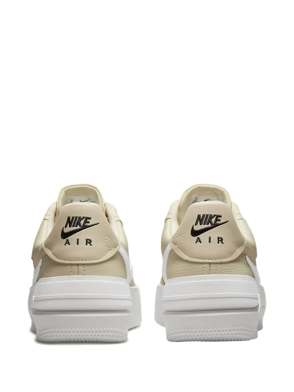 Beige sneakers with Nike Air logo on back heel and padded collar