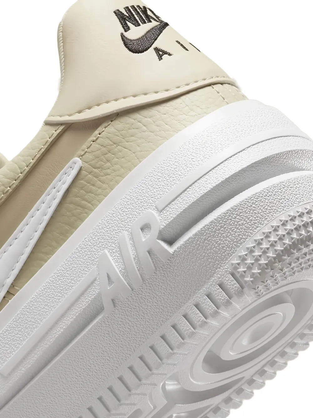 Beige leather sneaker upper with stitching detail and AIR logo on midsole