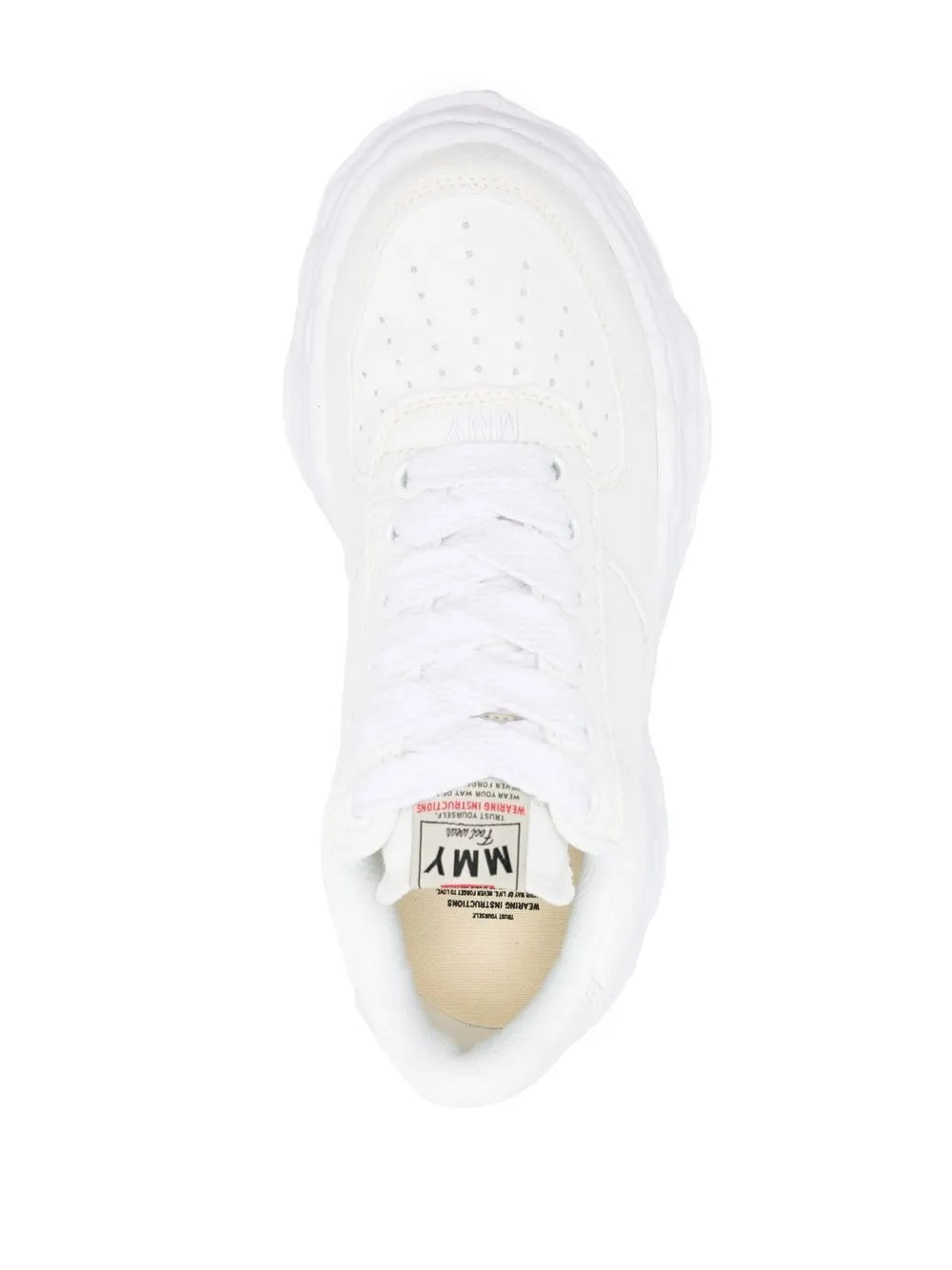 White leather sneakers with perforated toe and inner label, top view
