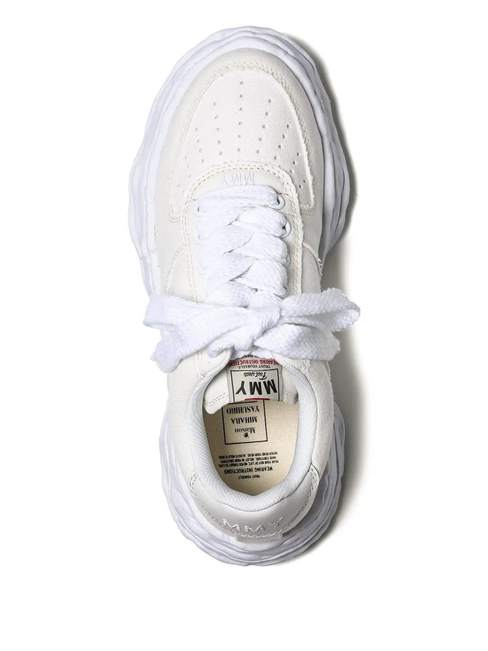 White leather sneaker with lace-up vamp and visible inner label, front view