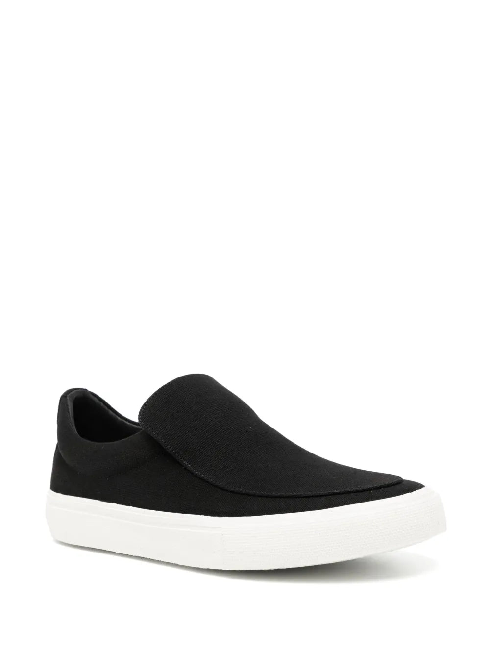 Black canvas slip-on sneaker with padded collar and white platform sole.