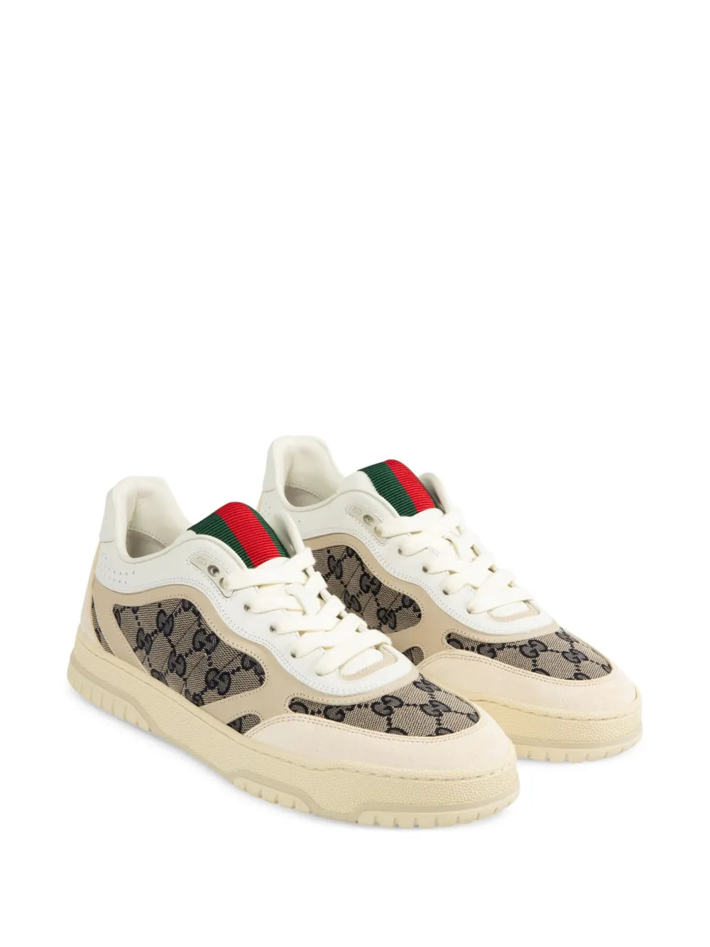 Cream lace-up sneakers, angled view, with GG logo panels and red-green web accents
