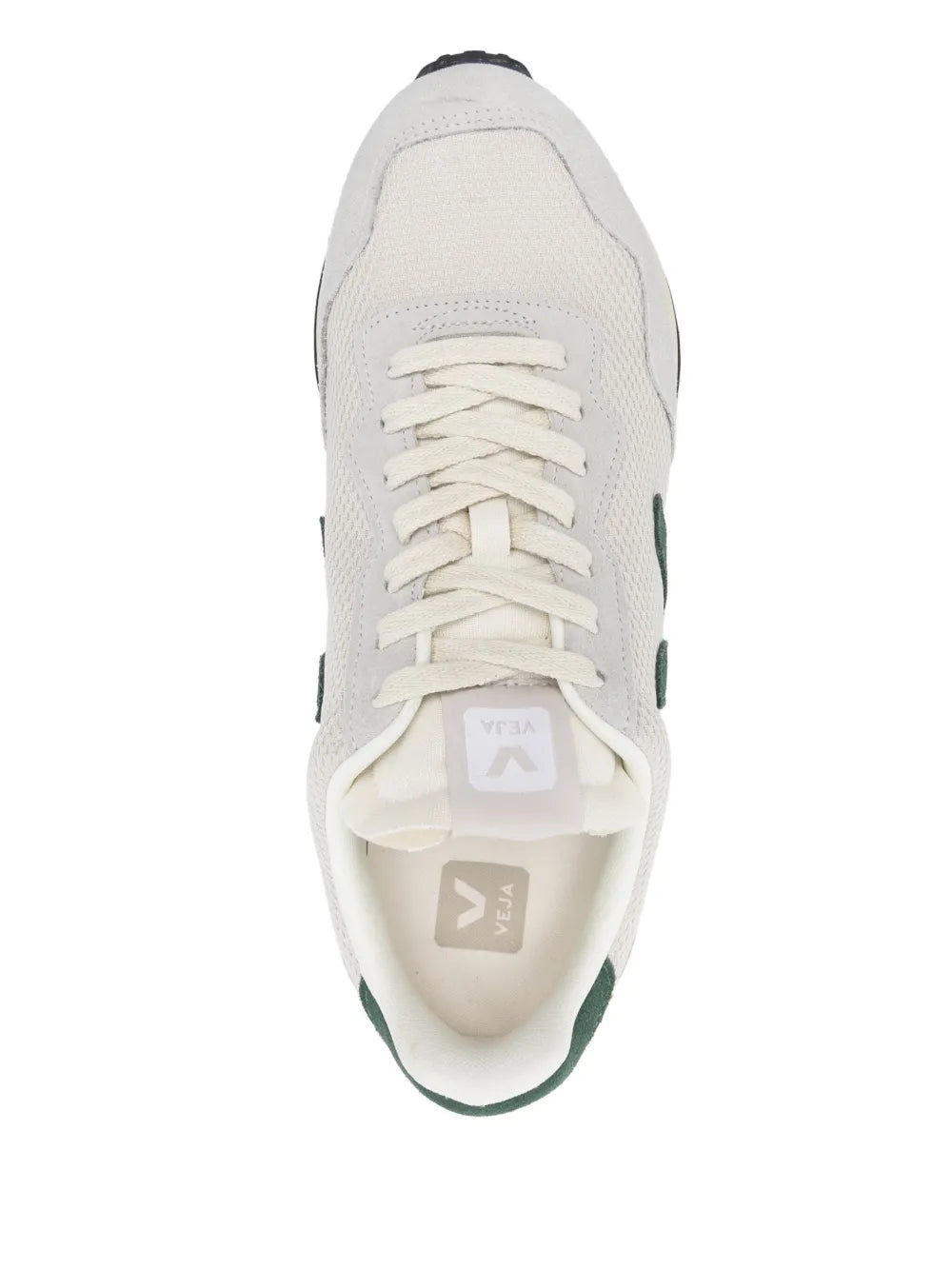 Cream low-top sneakers with lace-up front and green side logo