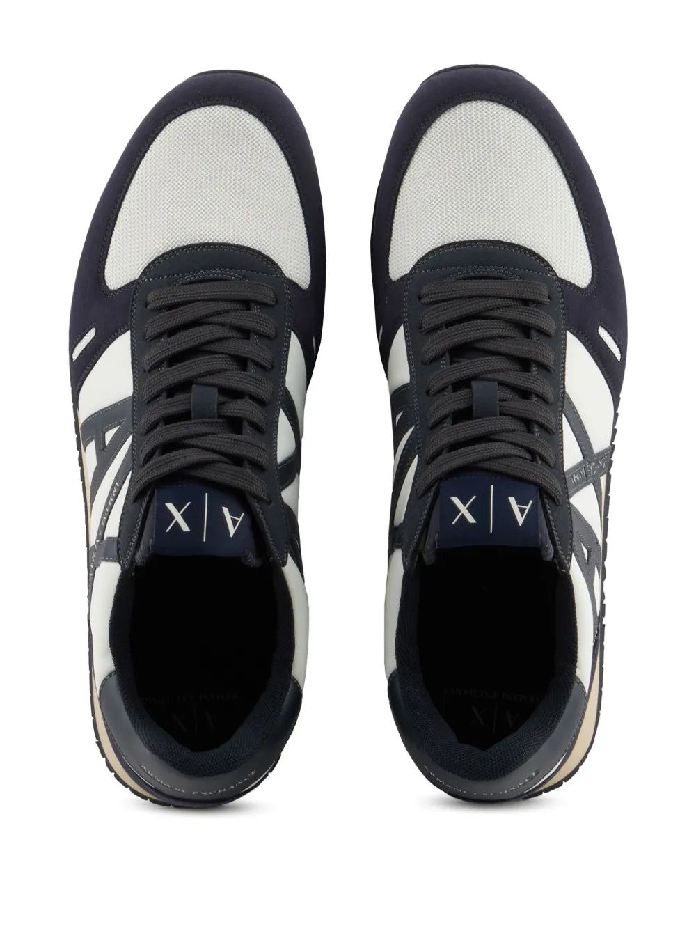 Navy and white sneakers front view, black lace-up with padded tongue