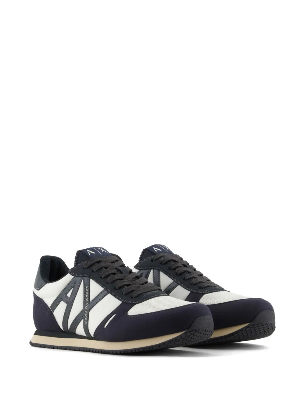 Navy and white logo-patch sneakers, side view with black laces and rubber tread