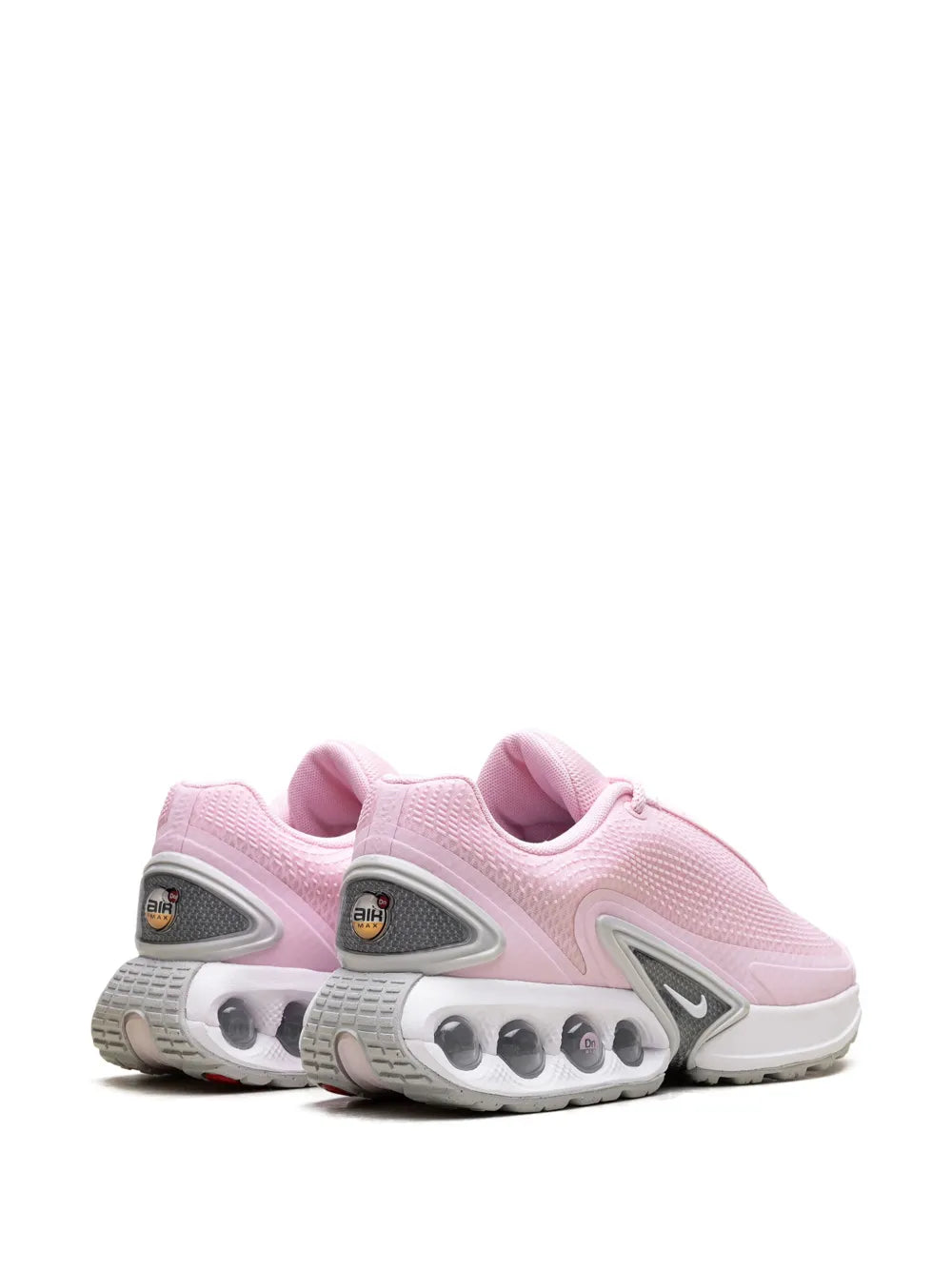 Pink Nike Air Max Dn shoe heel and side view, cushioned air pods on midsole